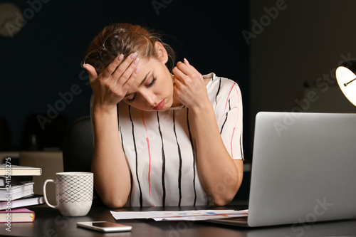 Tired businesswoman working...