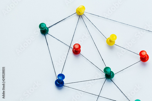 pins connected creating a network photo