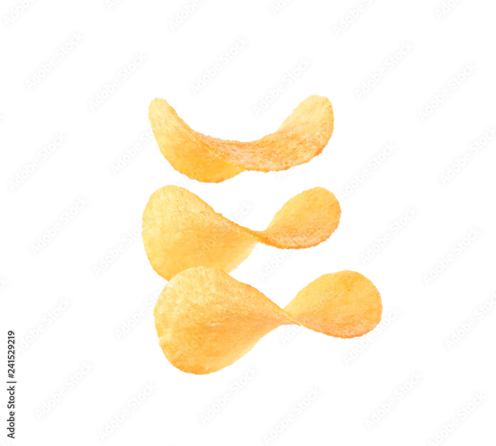 Tasty crispy potato chips on white background