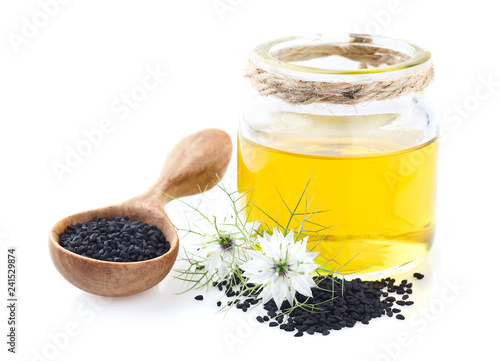 Black cumin oil on white background