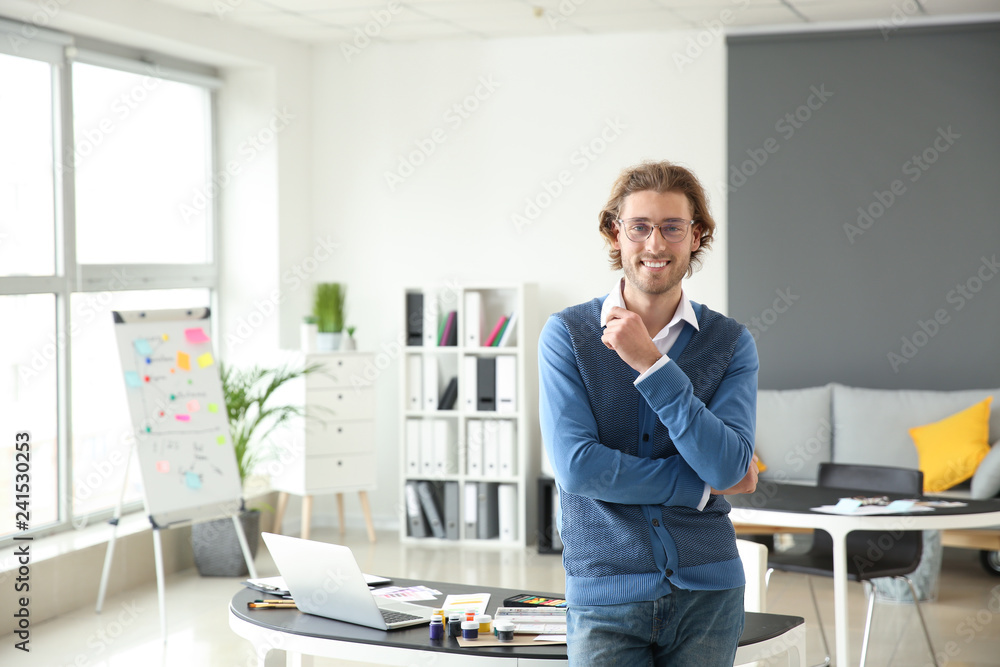 Portrait of young designer in office Portrait of young designer in office