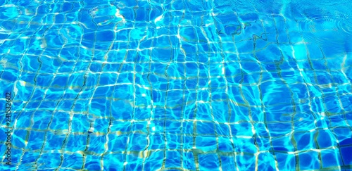 Wave or ripple water in swimming pool with sunlight reflection for background - Art or Abstract and Wallpaper concept 