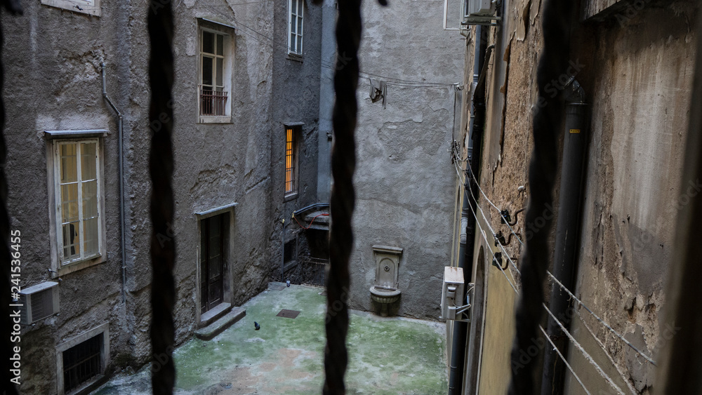 Lone and Empty Courtyard of old Houses in the Harbor City of Rijeka, Croatia