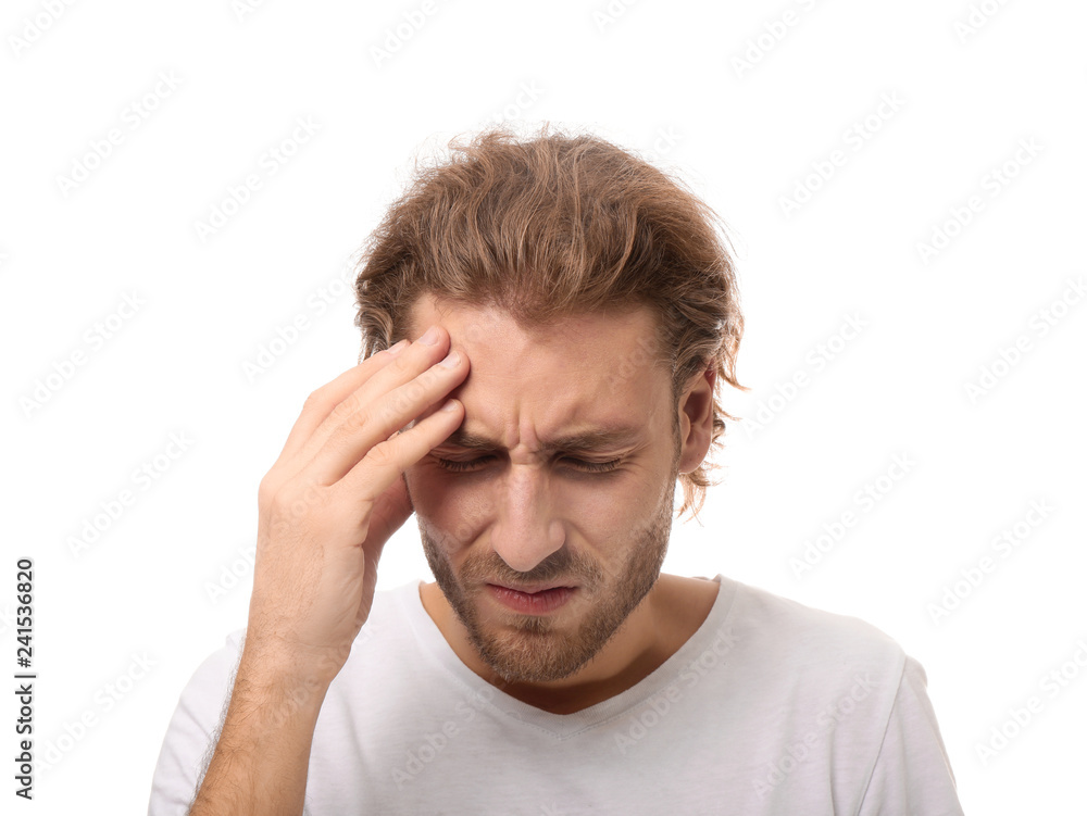 Young man suffering from headache on white background Young man suffering from headache on white background