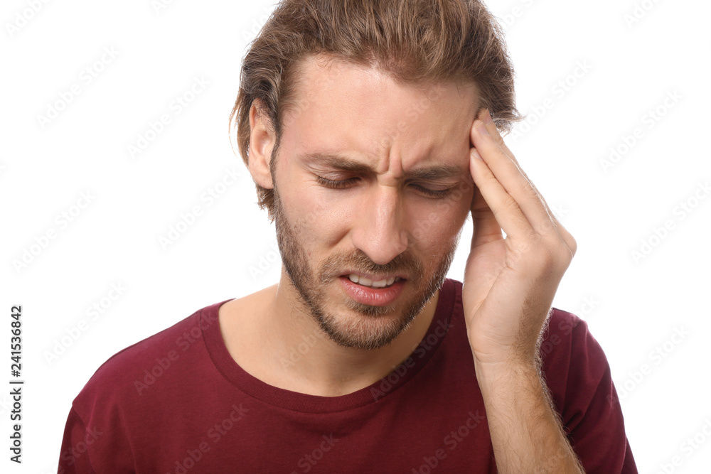 Young man suffering from headache on white background Young man suffering from headache on white background