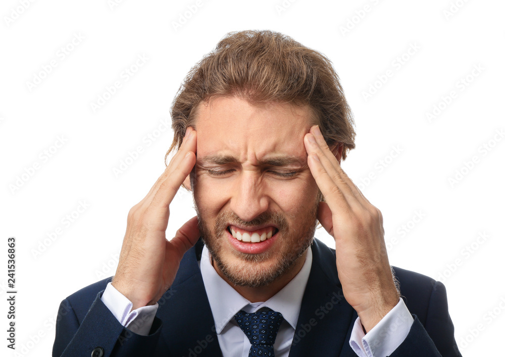 Young businessman suffering from headache on white background Young businessman suffering from headache on white background