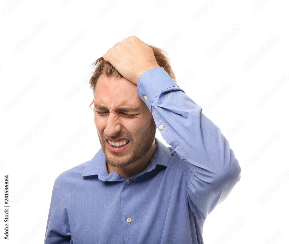 Young man suffering from headache on white background Young man suffering from headache on white background