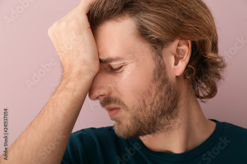 Young man suffering from he...