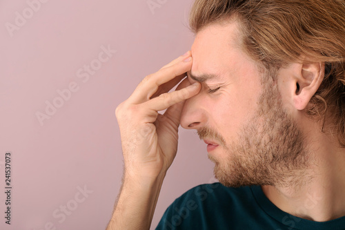 Young man suffering from he...