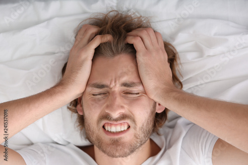 Young man suffering from he...