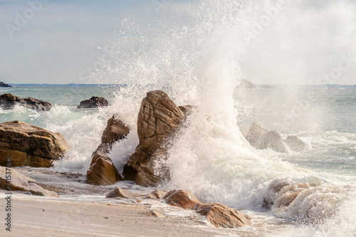 French landscape - Bretagne. A beautiful beach with wild cliffs in the background at sunset.