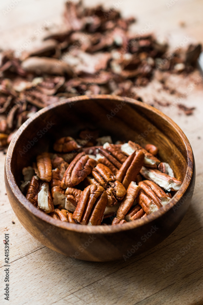 Peeled Pecan Nuts in Wooden Bowl without Shell / Walnuts. Peeled Pecan Nuts in Wooden Bowl without Shell / Walnuts.