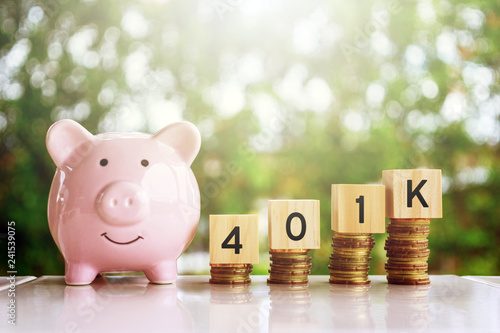 Wooden blocks with number 401k. Business and finance concept.