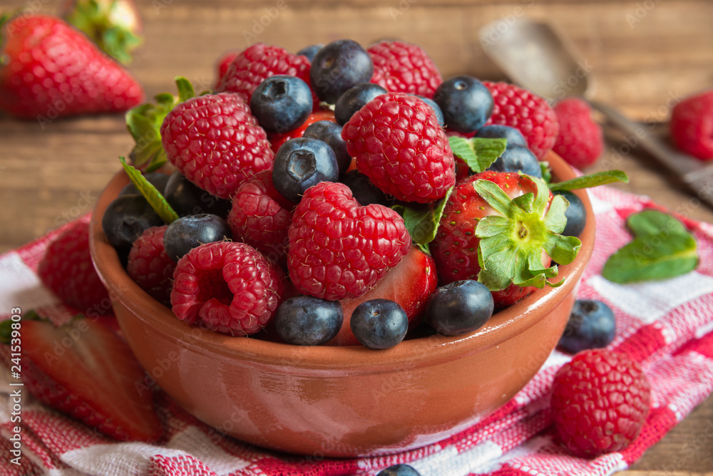 Fresh fruit salad on wooden table Fresh fruit salad on wooden table