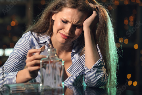 Young woman drinking alcoho...