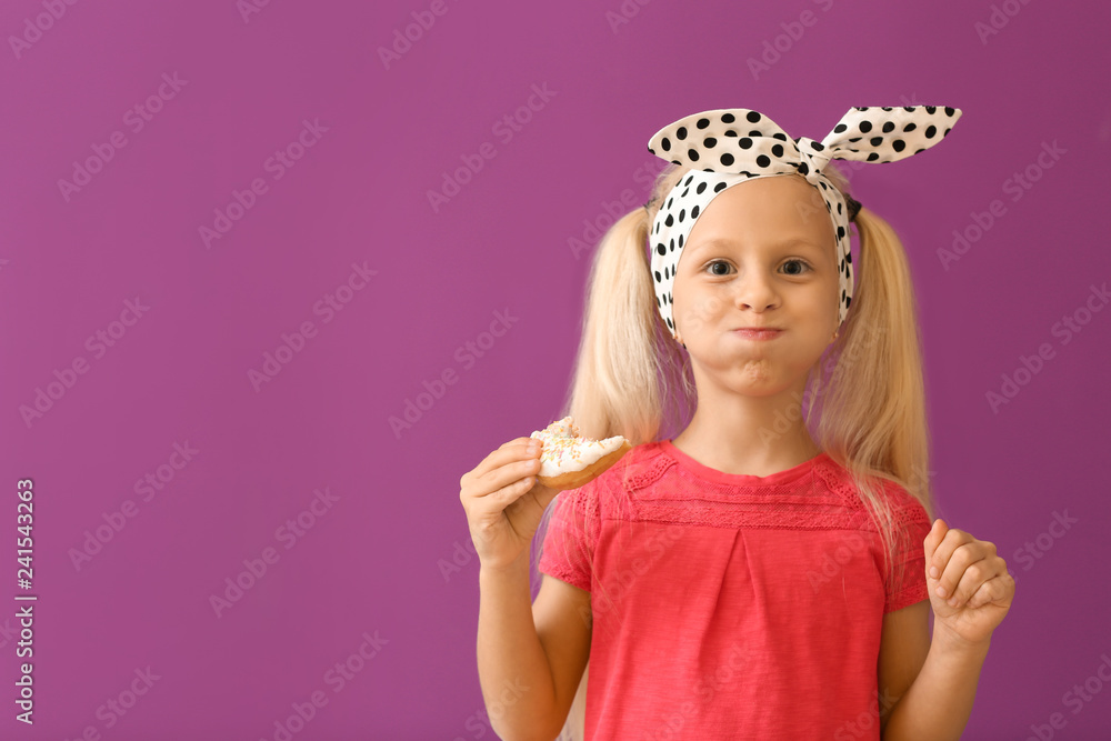 Cute little girl with donut on color background Cute little girl with donut on color background