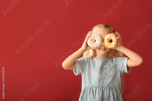 Cute little girl with donut...