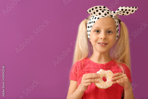 Cute little girl with donut...