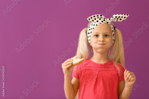 Cute little girl with donut...