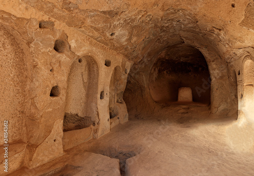 View of the ruins of the premises of the ancient prayer room in the caves of the old sandstones in the valleys of Cappadocia