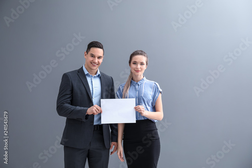 Young business people holdi...