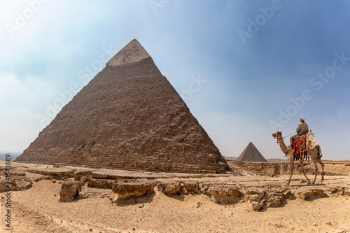 Panorama of the area with the great pyramids of Giza with Pyramid of Khafre  or Chephren  and the Pyramid of Menkaure in the far view  Egypt