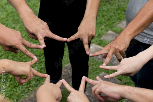 Hand fist touching together in star circle shap,show power of cooperation.