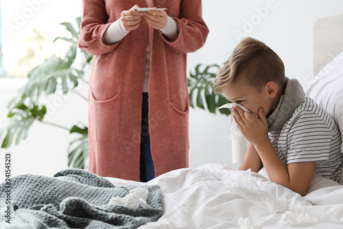 Mother taking care of his s...