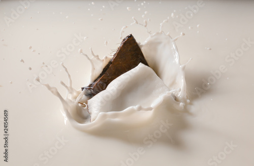 Throwing of coconut pieces into milk