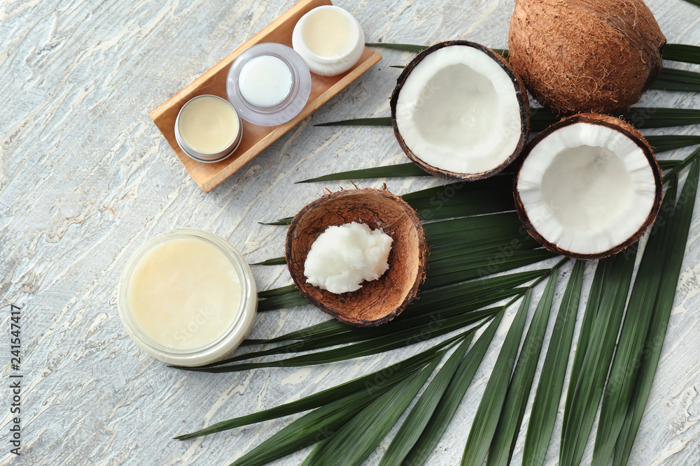 Composition with coconut oil on wooden background Composition with coconut oil on wooden background