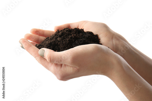 Female hands with soil on white background