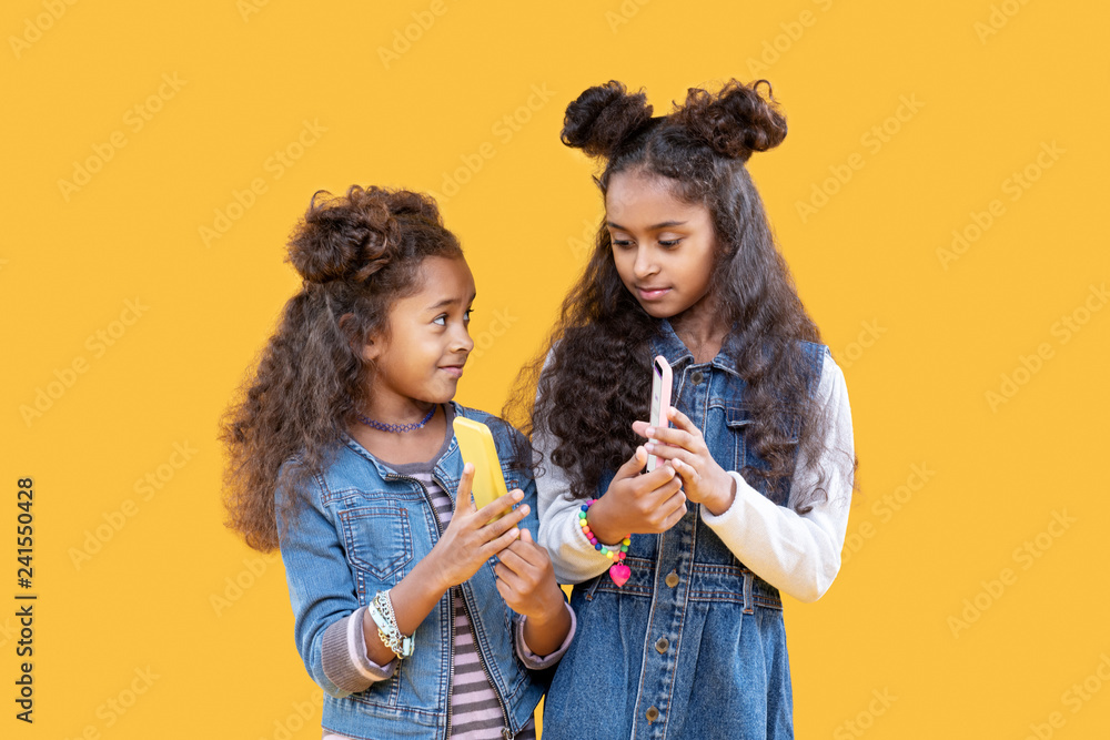 Pleasant nice girls showing each other their phones Pleasant nice girls showing each other their phones
