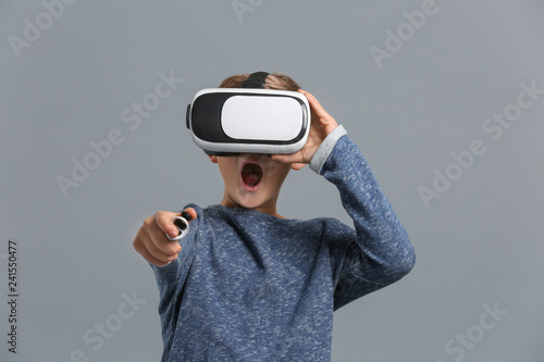 Cute boy with virtual reali...