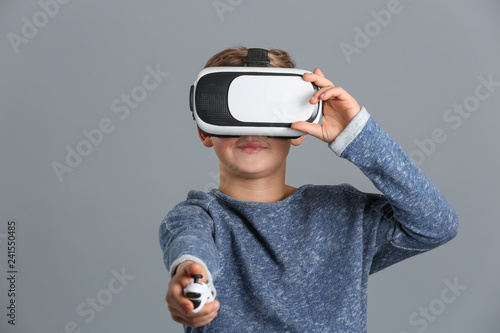 Cute boy with virtual reali...