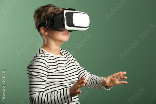 Cute boy with virtual reali...