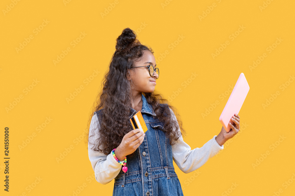 Cheerful nice girl looking at the tablet screen Cheerful nice girl looking at the tablet screen