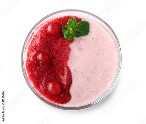 Glass of tasty cranberry milkshake on white background