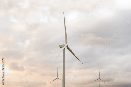 Landscape with turbine green energy generating electricity , windmills for electric power production.
