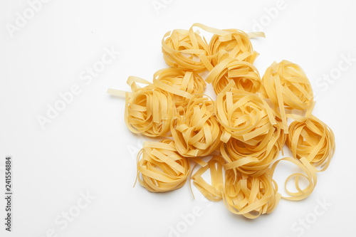 Uncooked pasta spaghetti macaroni isolated on white background