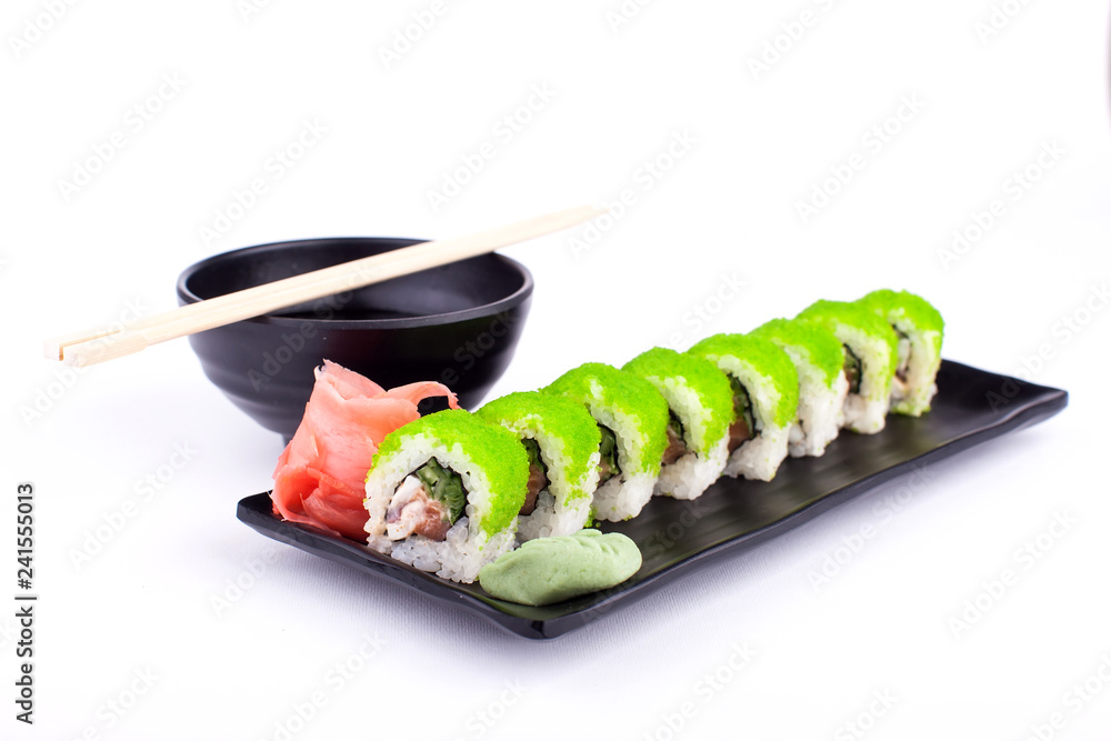 Sushi roll on black plate - traditional japanese food style Sushi roll on black plate - traditional japanese food style