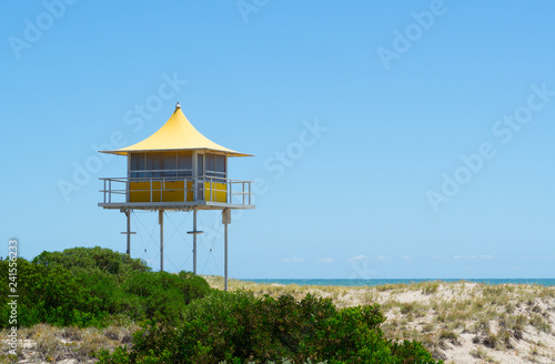 Yellow Lifeguard tower standing alone on seashore beach of Australia. © arliftatoz2205