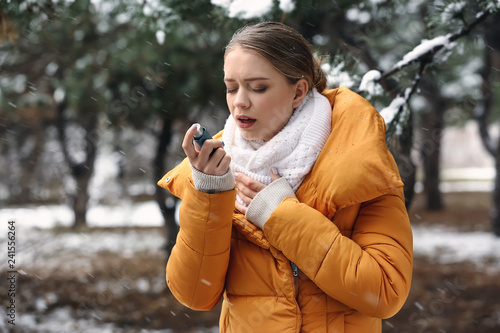 Young woman with inhaler ha...