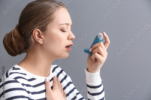 Young woman with inhaler ha...