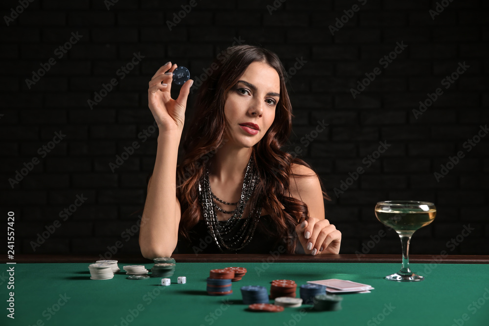 Female poker player at table in casino Female poker player at table in casino