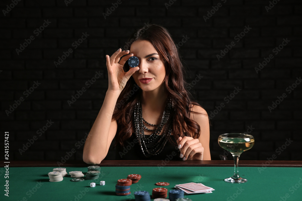 Female poker player at table in casino Female poker player at table in casino