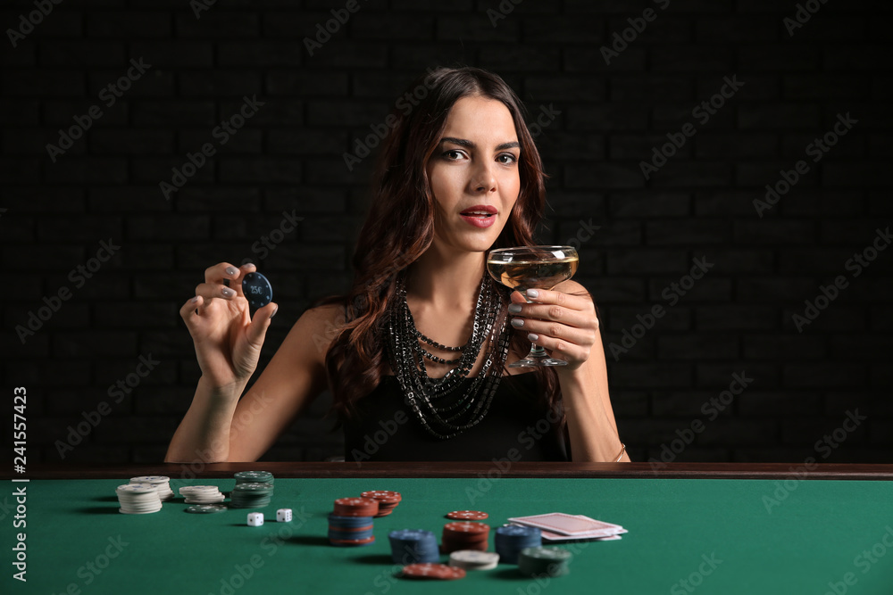 Female poker player at table in casino Female poker player at table in casino