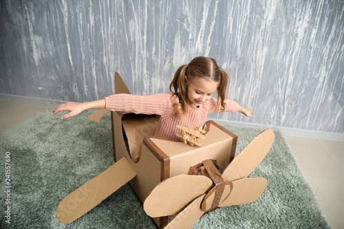 Little girl playing with ca...