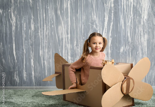 Little girl playing with ca...