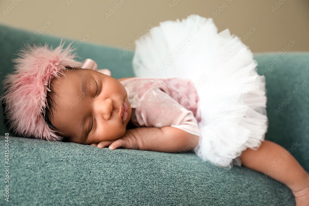 Portrait of cute African-American baby sleeping in soft armchair Portrait of cute African-American baby sleeping in soft armchair
