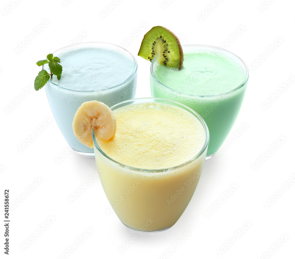 Glasses of tasty milkshakes on white background Glasses of tasty milkshakes on white background